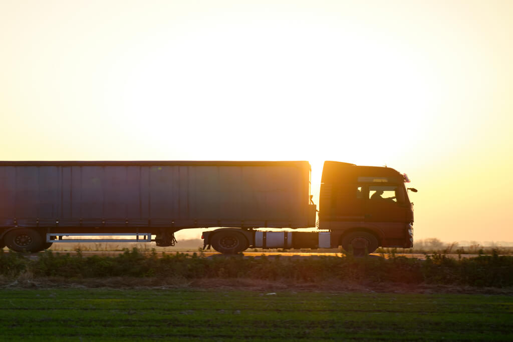 truck on the road on the background of sunset