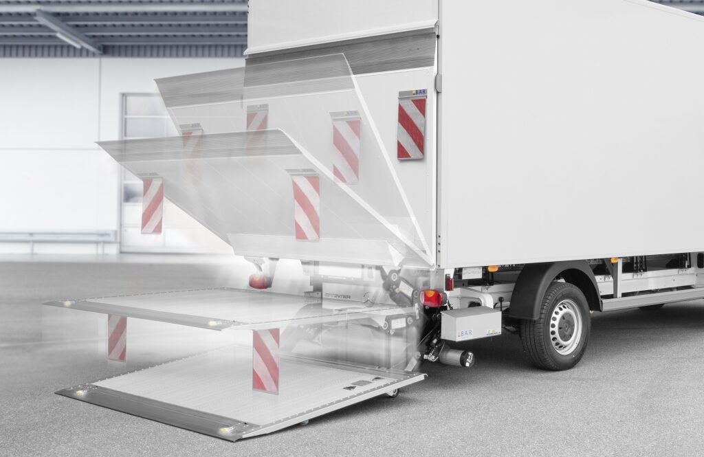 Hydraulic tail lift image overlay showing the tray at intervals lowering to the ground