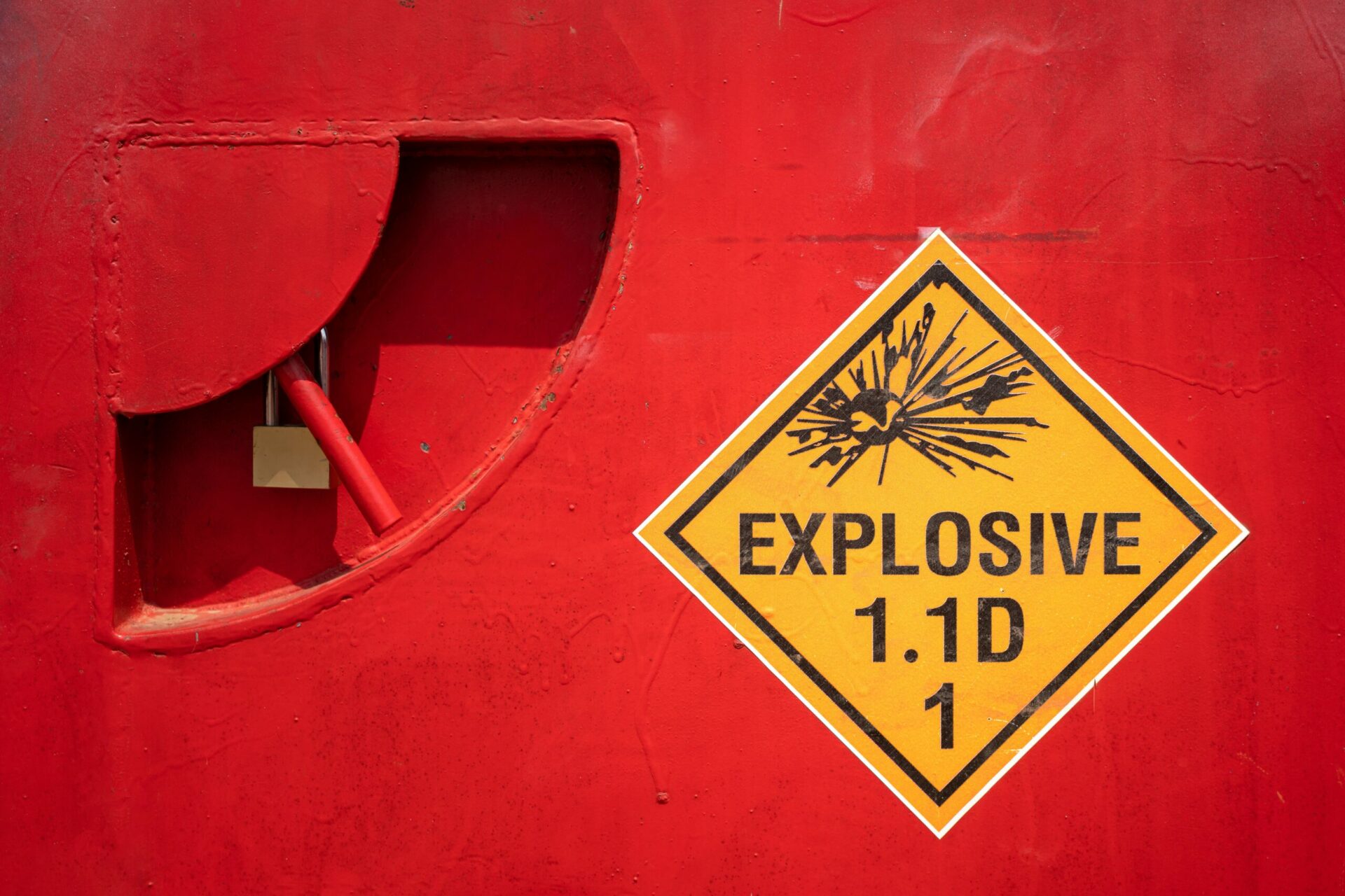 Explosives Hazard Sign on Red Steel Door