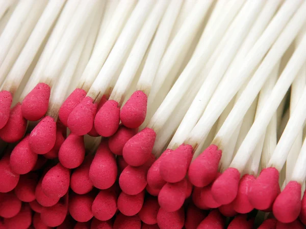 Matches, a commonly transported flammable solid, lie in a pile.